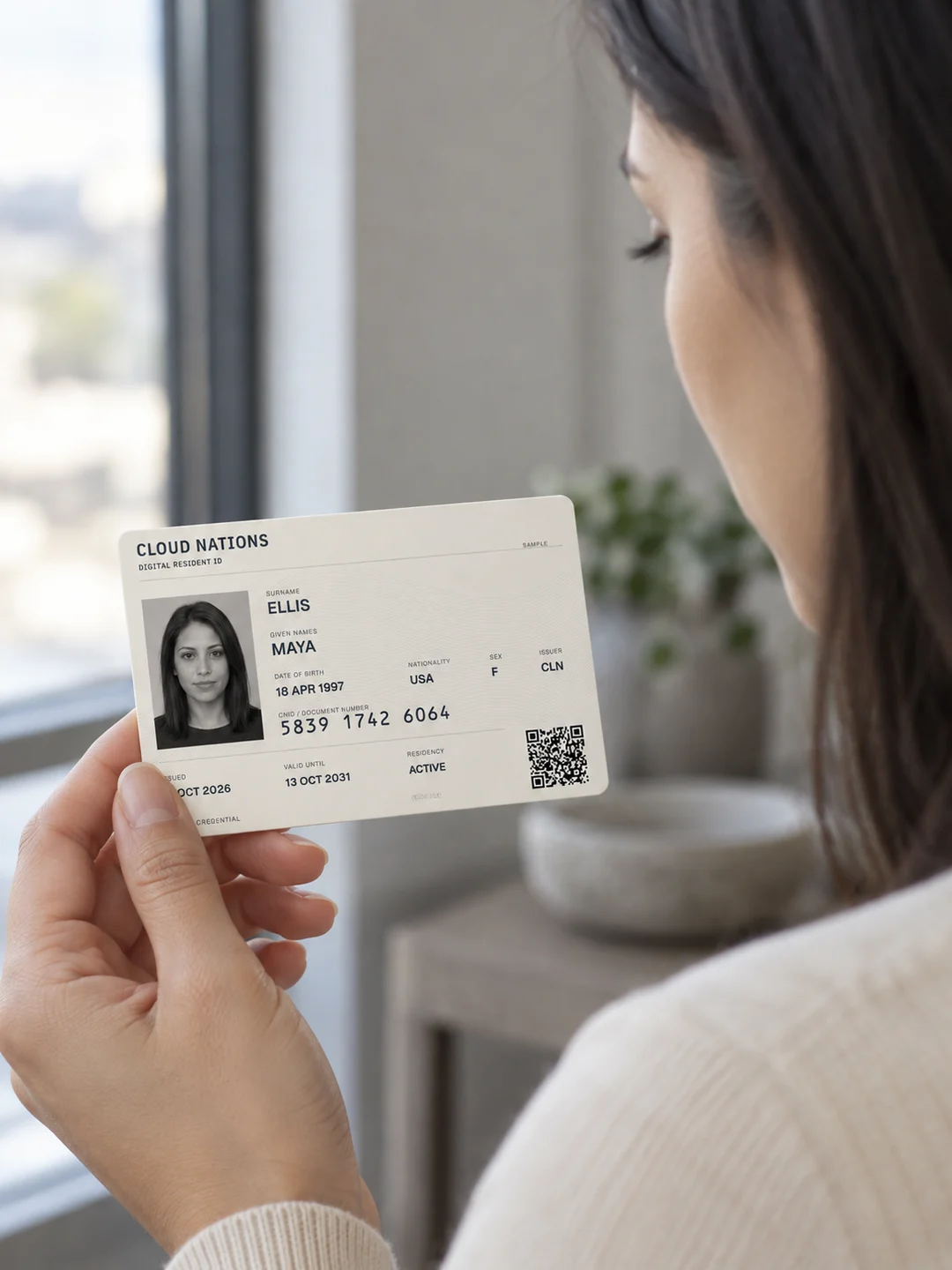 A person looking at a Cloud Nations Digital Resident ID.